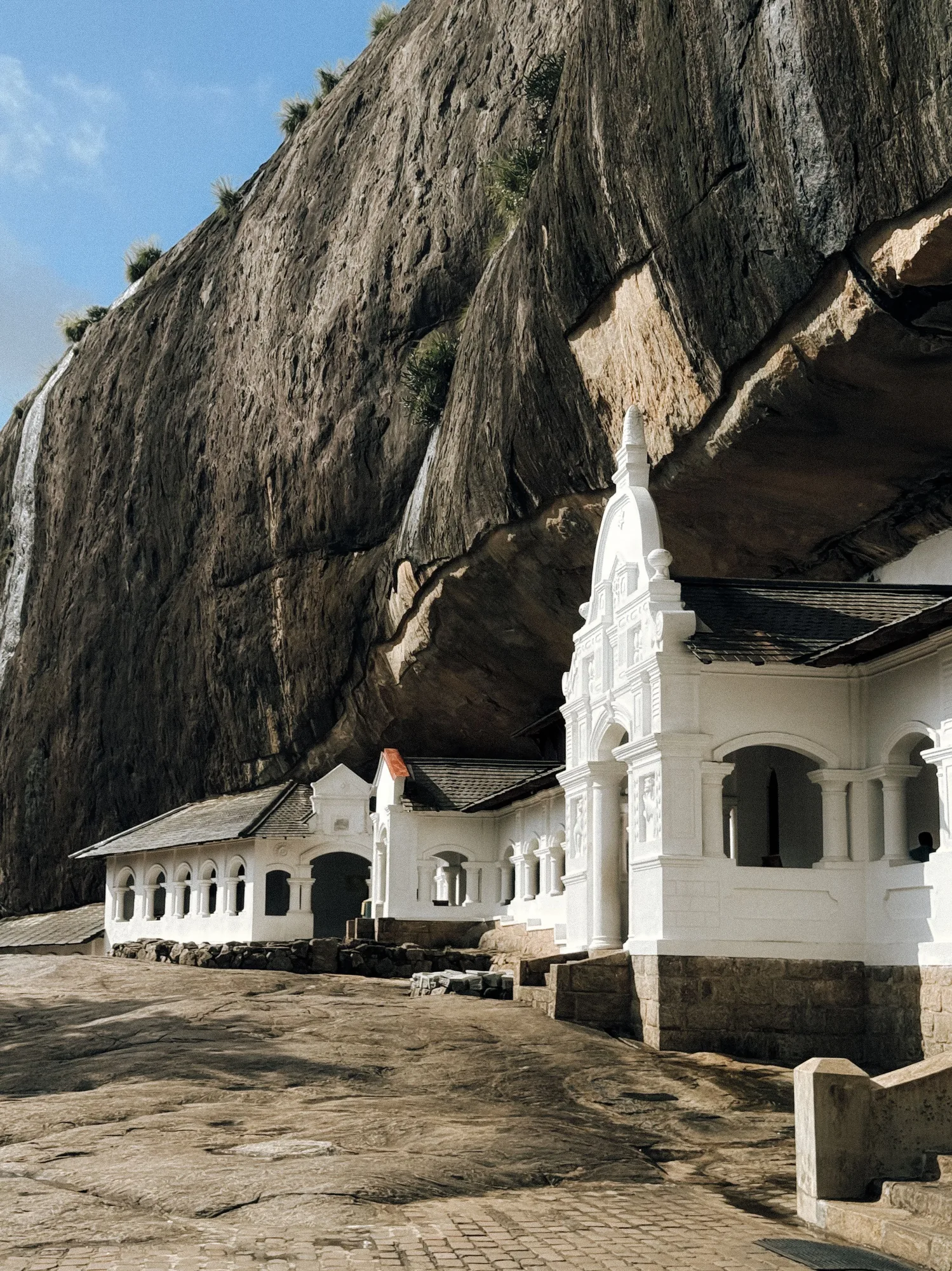Dambulla's cave temple sits against dramatic rock formations.